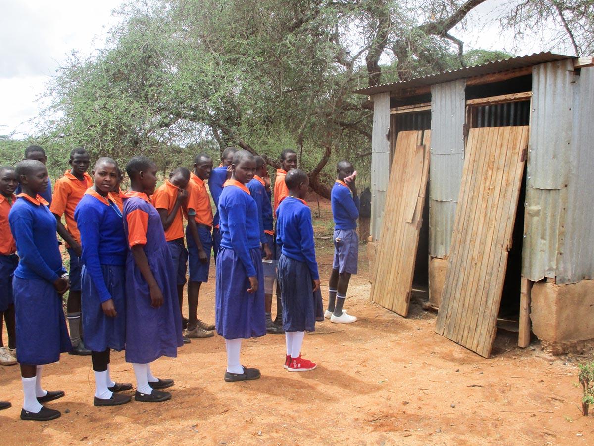 191125 Students in East Africa line up to use outdoor toilets